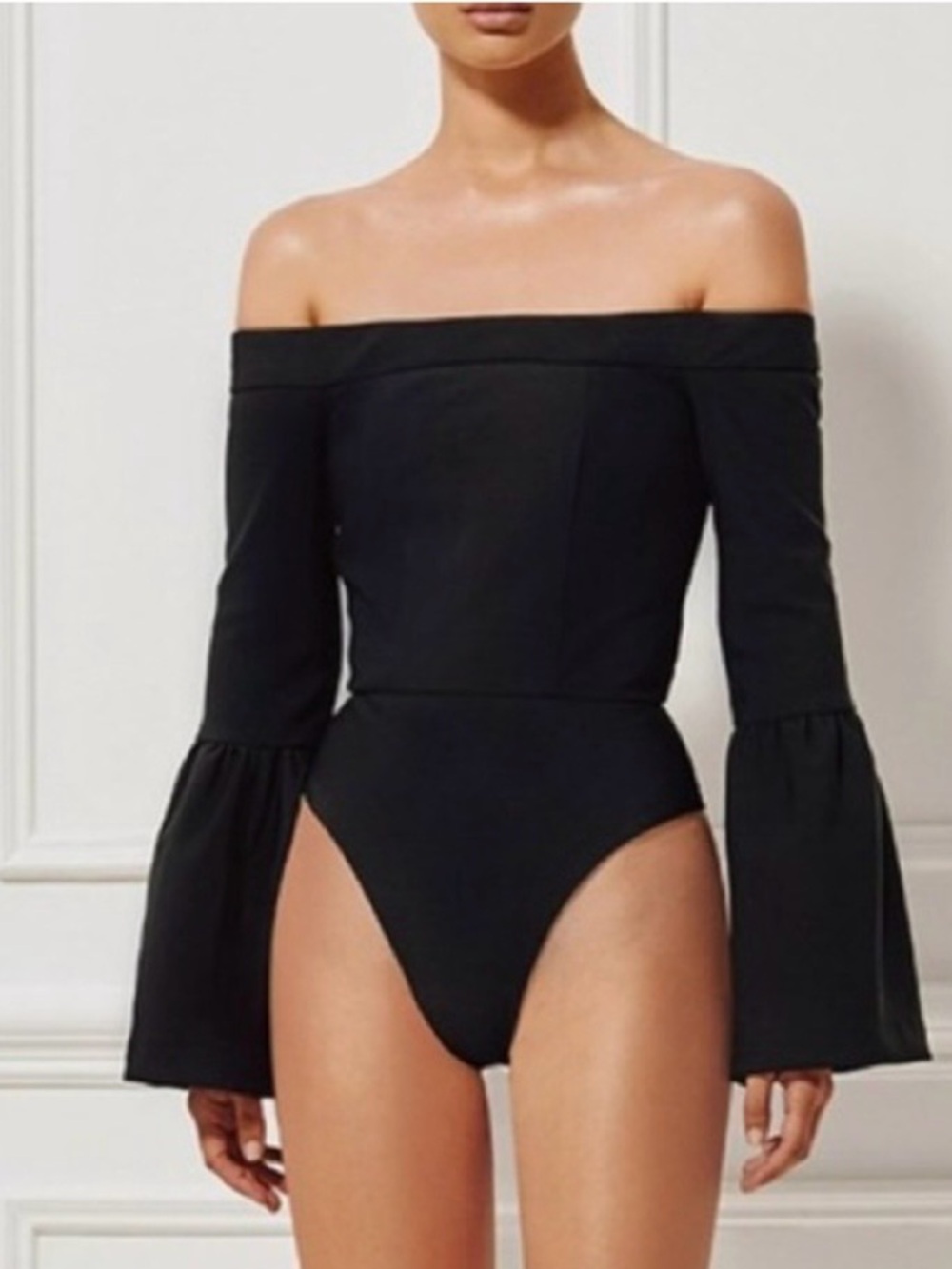 MISHA COLLECTION black garment with cream label